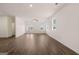Large living room with wood floors, recessed lighting, and double doors to backyard at 11884 Aukerman Way, Hampton, GA 30228