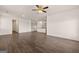 Open-concept floor plan with wood floors throughout the living room and kitchen at 11884 Aukerman Way, Hampton, GA 30228