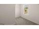 Walk-in closet with carpet flooring, wire shelving, and a window for natural light at 11884 Aukerman Way, Hampton, GA 30228