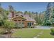 Sprawling backyard featuring a refreshing pool, well-maintained lawn, and a charming brick house, ideal for outdoor living at 305 Sherwood Rd, Fayetteville, GA 30215