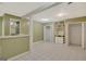Spacious basement with a tiled floor, bar area, and built-in shelving for storage and entertaining at 305 Sherwood Rd, Fayetteville, GA 30215