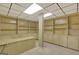 Finished basement with tiled floors and built-in wooden shelving and cabinets all around, creating a cozy atmosphere at 305 Sherwood Rd, Fayetteville, GA 30215