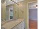 Bathroom vanity with granite countertop, decorative lighting, and anchor themed towel hooks at 305 Sherwood Rd, Fayetteville, GA 30215