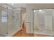 Bathroom featuring a glass shower, tile surround, and access to a walk-in closet at 305 Sherwood Rd, Fayetteville, GA 30215