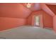 Bedroom with neutral carpet, sloped ceiling, and access to a balcony at 305 Sherwood Rd, Fayetteville, GA 30215