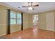 Bedroom featuring hardwood flooring, neutral walls, and a window with plantation shutters at 305 Sherwood Rd, Fayetteville, GA 30215