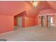 Bedroom with neutral carpet, sloped ceiling, mirrored closet doors at 305 Sherwood Rd, Fayetteville, GA 30215