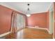 Elegant dining room with hardwood floors, shutters, and modern chandelier at 305 Sherwood Rd, Fayetteville, GA 30215
