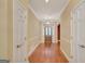 Inviting entryway boasts hardwood floors and a stylish light fixture, creating a warm welcome at 305 Sherwood Rd, Fayetteville, GA 30215