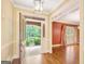 Inviting foyer with hardwood floors, elegant lighting, and decorative trim, offering a glimpse into the home's design at 305 Sherwood Rd, Fayetteville, GA 30215
