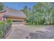 Attached garage with a basketball hoop on a sunny day, offering convenience and outdoor activity at 305 Sherwood Rd, Fayetteville, GA 30215