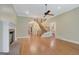 Spacious living room featuring a cozy fireplace, staircase, and natural light, perfect for relaxation at 305 Sherwood Rd, Fayetteville, GA 30215