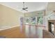 Bright living room with a brick fireplace and ample windows offering serene backyard views at 305 Sherwood Rd, Fayetteville, GA 30215