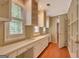 Office with built-in shelving, workspace, and natural light from window with plantation shutters at 305 Sherwood Rd, Fayetteville, GA 30215