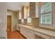 Office with built-in shelving, workspace, and natural light from window with plantation shutters at 305 Sherwood Rd, Fayetteville, GA 30215