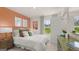 Serene bedroom featuring a decorative accent wall, natural light, and chic furnishings at 566 Silver Moon Dr, Loganville, GA 30052