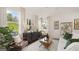 Inviting living room featuring stylish furniture, natural light, and views, perfect for relaxation and entertaining at 566 Silver Moon Dr, Loganville, GA 30052