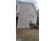 Shows the side exterior of the home, vinyl siding, and some visible wear at 6265 Gemstone Ct, South Fulton, GA 30349