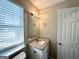 Bathroom with a granite countertop vanity and a bright window at 4320 Catalpa Way, Ellenwood, GA 30294