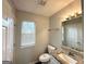 Bathroom featuring a granite vanity and a large mirror, with natural light at 4320 Catalpa Way, Ellenwood, GA 30294