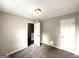 Bedroom with carpet, a window and a standard closet with a white door at 4320 Catalpa Way, Ellenwood, GA 30294