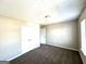 Bedroom showcasing carpet, a window, and double doors, ready for your personal touch at 4320 Catalpa Way, Ellenwood, GA 30294