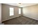 Comfortable bedroom offering neutral walls, soft carpeting, and bright natural lighting at 4320 Catalpa Way, Ellenwood, GA 30294
