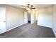 Bedroom with a ceiling fan, closet and an open door to the hallway at 4320 Catalpa Way, Ellenwood, GA 30294