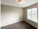 Bedroom features neutral carpet, paint, and a window for natural light at 4320 Catalpa Way, Ellenwood, GA 30294