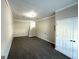 Bonus room showcasing carpet flooring with ample lighting, ready for customization at 4320 Catalpa Way, Ellenwood, GA 30294