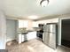 Modern kitchen featuring stainless steel appliances, bright white cabinets, and stylish countertops at 4320 Catalpa Way, Ellenwood, GA 30294