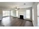 Spacious living room filled with natural light, highlighted by a classic fireplace and modern flooring at 4320 Catalpa Way, Ellenwood, GA 30294