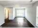 Open-concept living space with sleek flooring, abundant natural light, and a seamless flow at 4320 Catalpa Way, Ellenwood, GA 30294