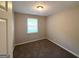 Cozy bedroom featuring neutral walls and plush carpet, offering a serene retreat at 2784 Rockdale Dr, Decatur, GA 30034