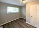 Comfortable bedroom with hardwood floors, large window, and closet at 2784 Rockdale Dr, Decatur, GA 30034