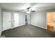Cozy bedroom with carpet floors, ceiling fan, and closet at 2784 Rockdale Dr, Decatur, GA 30034