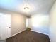 Neutral bedroom with plush carpet featuring white doors and natural light at 2784 Rockdale Dr, Decatur, GA 30034