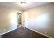 Bedroom featuring neutral walls and plush carpeting, providing comfort and style at 2784 Rockdale Dr, Decatur, GA 30034
