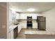 Bright kitchen featuring stainless steel appliances, granite counters, and white cabinetry at 2784 Rockdale Dr, Decatur, GA 30034