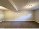 Unfinished living room showing carpet, beige walls, and recessed lights at 2784 Rockdale Dr, Decatur, GA 30034