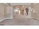 Finished basement with archways, pillars and stairwell to upper level at 115 Robinwood Ct, Fayetteville, GA 30214