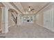 Finished basement with archways, pillars, stairwell and fireplace feature at 115 Robinwood Ct, Fayetteville, GA 30214