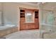 Bathroom featuring a soaking tub, walk-in shower, and -and- vanities at 115 Robinwood Ct, Fayetteville, GA 30214