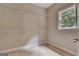 Walk-in closet with multiple shelving units and a window for natural light at 115 Robinwood Ct, Fayetteville, GA 30214