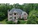 Beautiful brick home nestled among mature trees at 115 Robinwood Ct, Fayetteville, GA 30214