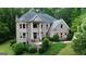 Stunning brick home with manicured landscaping and mature trees at 115 Robinwood Ct, Fayetteville, GA 30214