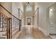Elegant foyer featuring high ceilings and hardwood flooring at 115 Robinwood Ct, Fayetteville, GA 30214