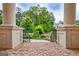 Covered porch with brick flooring and decorative pillars at 115 Robinwood Ct, Fayetteville, GA 30214