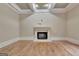 An elegant living room featuring a fireplace and hardwood flooring at 115 Robinwood Ct, Fayetteville, GA 30214