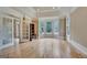Spacious living room boasts hardwood floors, and a bay window with backyard views at 115 Robinwood Ct, Fayetteville, GA 30214